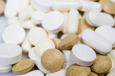 Many colorful medical pills and vitamins as a background