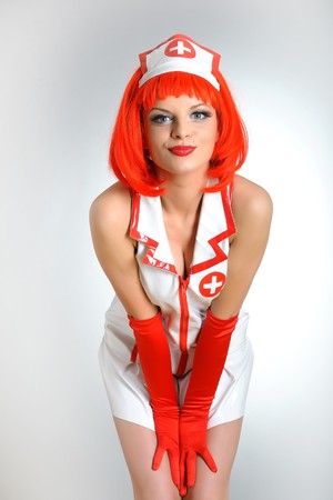 Young sexy nurse with red hair  の写真素材