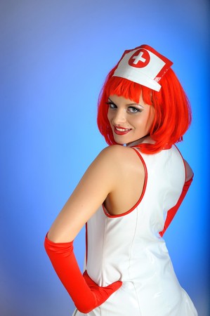 Young sexy nurse with red hair の写真素材
