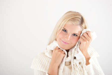 Portrait of beautiful smiling winter woman in knit clothesの写真素材