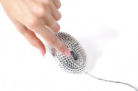 Beautiful hand with perfect manicure and glamour computer mouse pad with chrystalsの写真素材