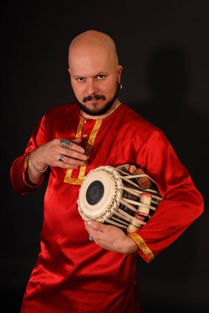 Musician with oriental tabla drum instrument 