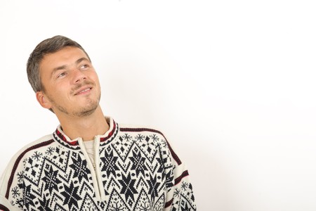 Handsome winter man in warm clothes thinkingの写真素材