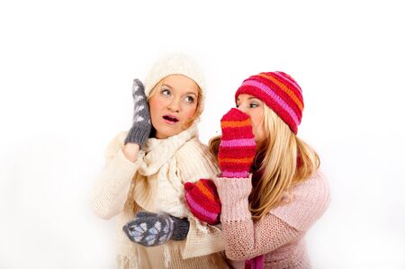 two funny Winter woman friends in warm clothes の写真素材