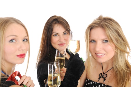 Group of three beautiful woman with glasses of champagne celebrating on party. isolated on white backgroundの写真素材