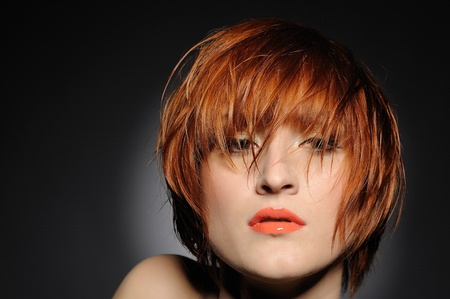 Beautiful red heaired woman portrait with fashion hairstyle from salonの写真素材