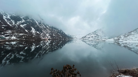 Panoramic view of fjord in india. Beautiful winter landscape. Tsomgo Lake, also known as Tsongmo Lake or Changgu Lake, is a glacial lake in the East Sikkim.の写真素材