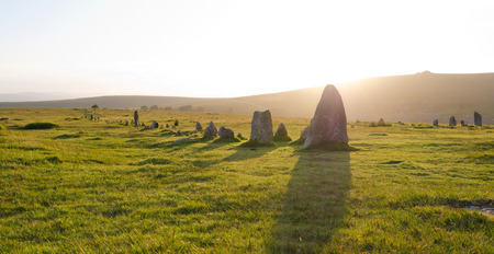 DARTMOOR, DEVON. 11th August 2016. The two Bronze Age stone avenues at Merrivale Prehistoric Settlement, Devon, looking west into the evening sun.のeditorial素材