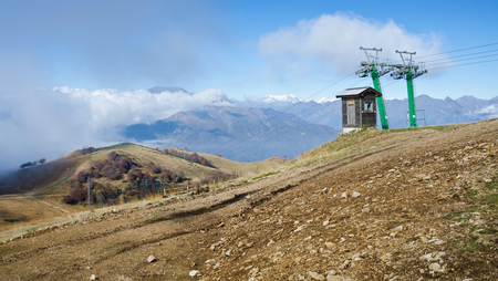 STRESA, PIEDMONT, ITALY. 27th OCTOBER 2016. A ski-lift stands redundant on the snowless slopes of Mottarone, Piedmont, Italy.のeditorial素材