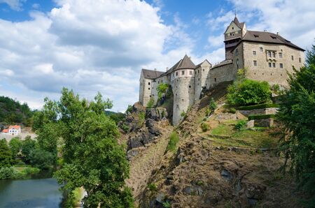 LOKET, CZECH REPUBLIC. 1st August 2019. The 12th Century Gothic Loket Castle stands proudly above a bend in the Ohre River and draws increasing numbers of foreign tourists each year.のeditorial素材