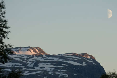 Moonlight at snowcovered mountain