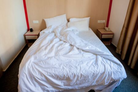 White bed in hotel room