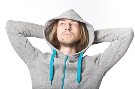 Portrait of young man with long blond hair and in the hood, on a white backgroundの写真素材