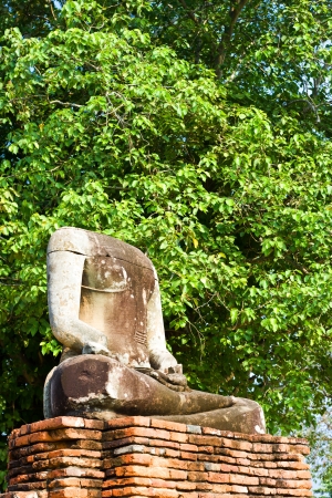 The headless buddha sitting on the wall at Ayutthaya Thailandの写真素材