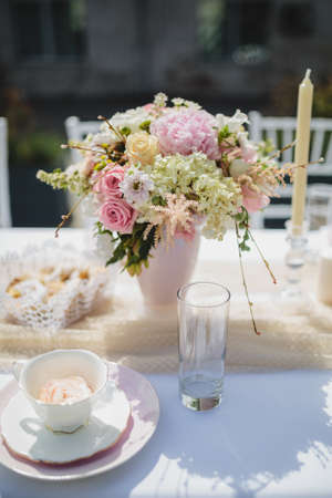 Tea cup and flowers, decoration for breakfast conceptの写真素材