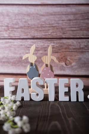 Three-dimensional inscription in plaster letters Easter with decor