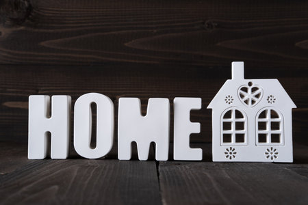 Word Home made from white concrete letters on the wooden background.の写真素材