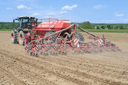 Planting corn trailed planter in the fieldの写真素材