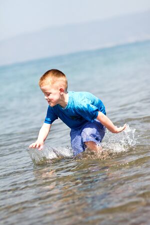 little boy having fun on summer holidayの写真素材