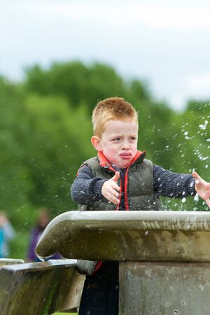 A young boy having fun in the countrysideの写真素材