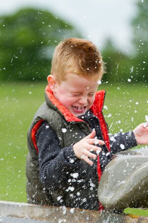 A young boy having fun in the countryside