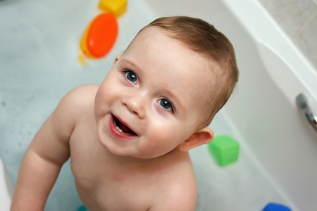 Blue eyed boy in the tub