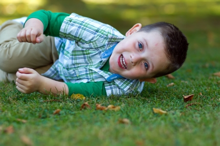 cute little boy playing at the parkの写真素材