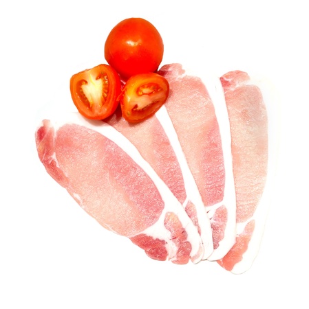 raw uncooked bacon and tomato isloated の写真素材