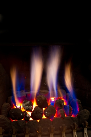 gas fire burning strongly inside a modern homeの写真素材