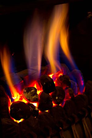gas fire burning strongly inside a modern homeの写真素材