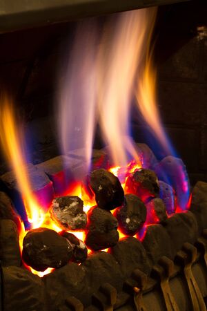 gas fire burning strongly inside a modern homeの写真素材