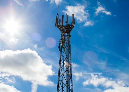 Mobile phone mast with a blue sky behindの写真素材