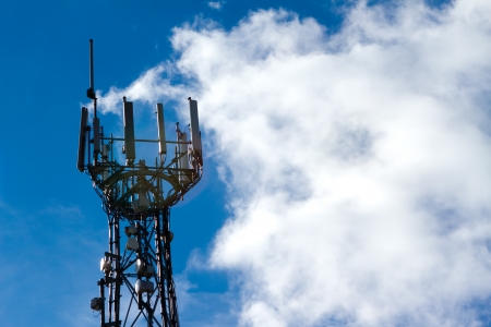 Mobile phone mast with a blue sky behindの写真素材