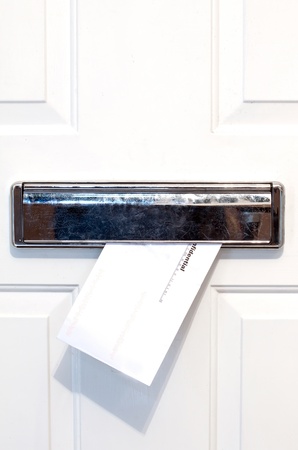 letter coming through the letterboxの写真素材