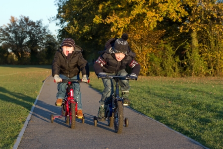 boys riding their bikes a country parkの写真素材