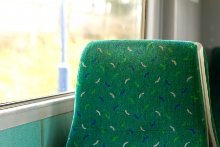 empty seat by the window on a train carrigeの写真素材