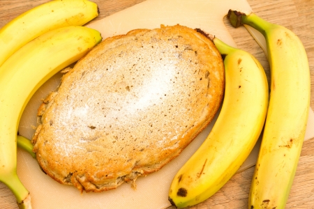 Freshly baked banana cake on wooden table topの写真素材