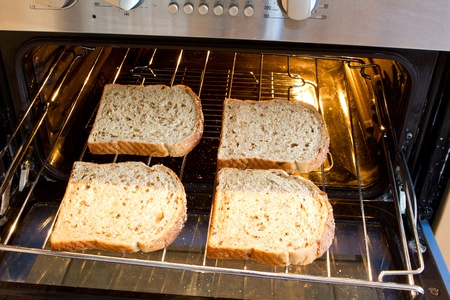 toast about to go under the grillの写真素材