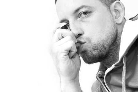 man inhaling his asthma pump