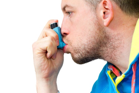 man inhaling his asthma pumpの写真素材