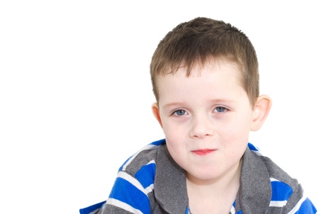 smiling happy little boy with brown hairの写真素材