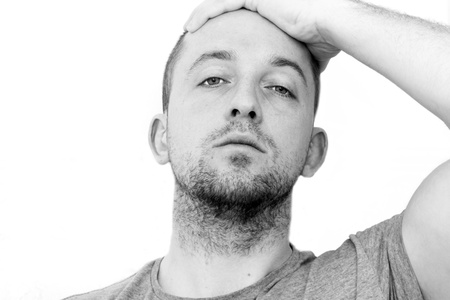 depressed man with head in his handsの写真素材