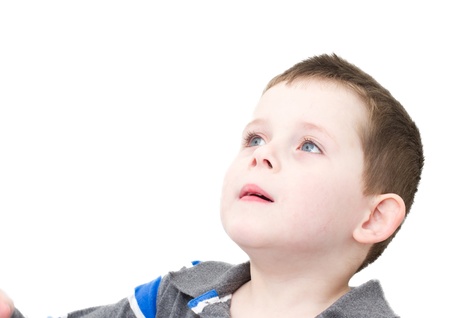 little boy looking upwardsの写真素材