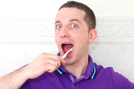 normal man brushing teethの写真素材
