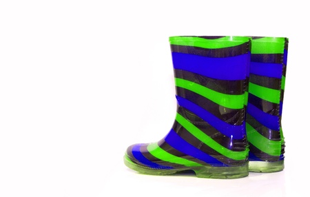 Multi Coloured wellington Boots on white with copy spaceの写真素材
