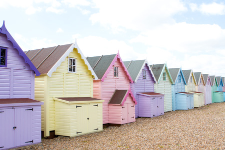Traditional British beach huts on a bright sunny dayの写真素材