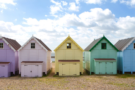 Traditional British beach huts on a bright sunny dayの写真素材