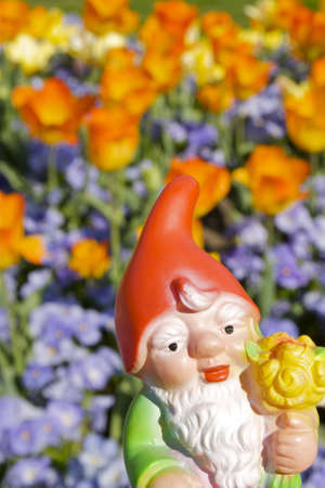 Garden gnome with flowersの写真素材