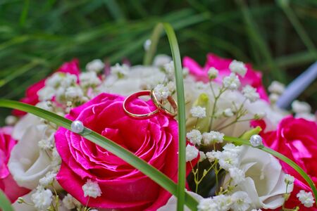 Wedding rings on the bouquetの写真素材