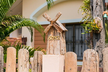 Small nice wooden mill house decoration near the gatesの写真素材